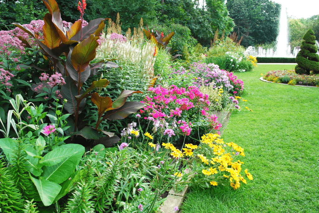 colorful-garden-flowers-grass-fountain
