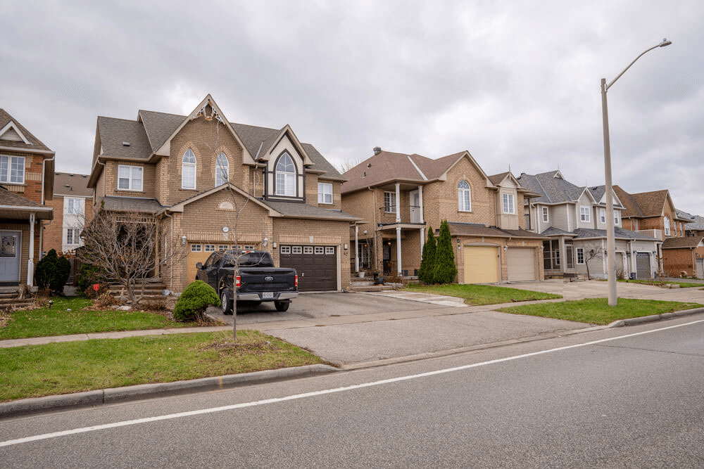 suburban-street-brick-houses-parked-cars