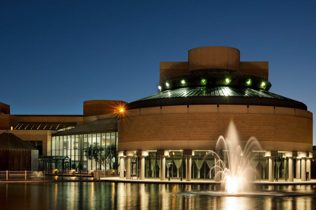 Markham Civic Centre at night with fountain and reflection in water Takeoff-Moving Toronto