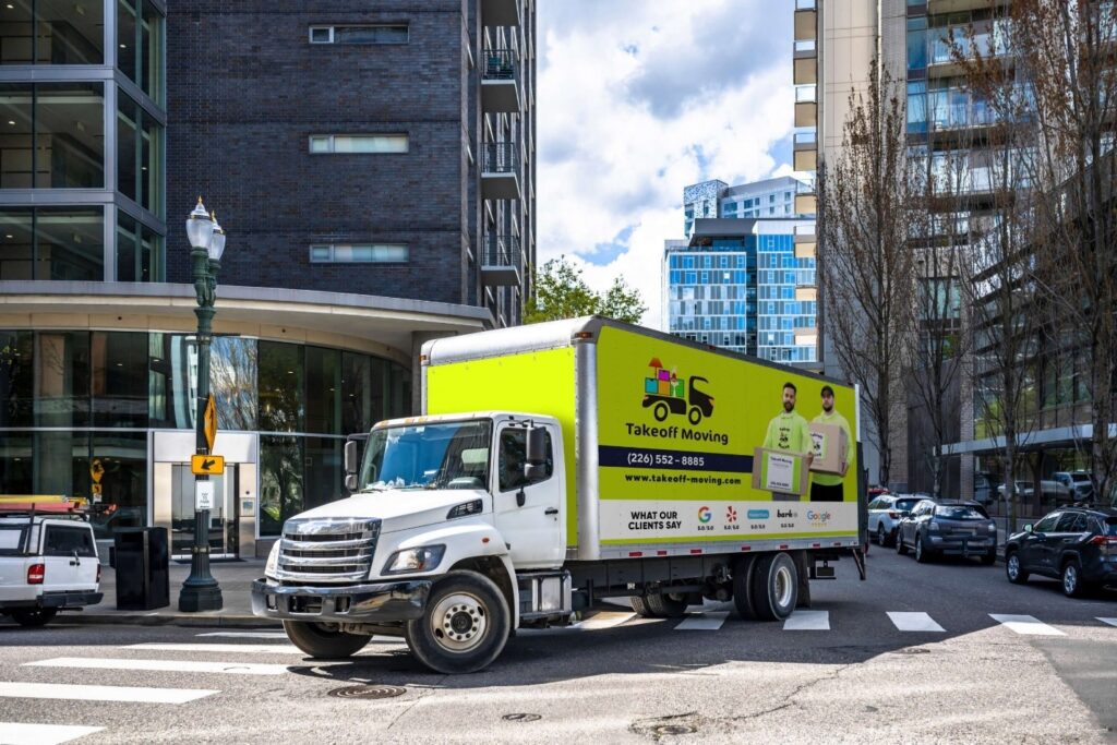 Takeoff Moving truck on a city street, assisting businesses in motion. Takeoff-Moving Toronto