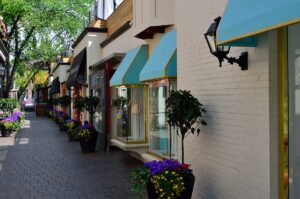 Yorkville street with shops, awnings, and flowers, reflecting upscale Toronto living. Takeoff-Moving Toronto