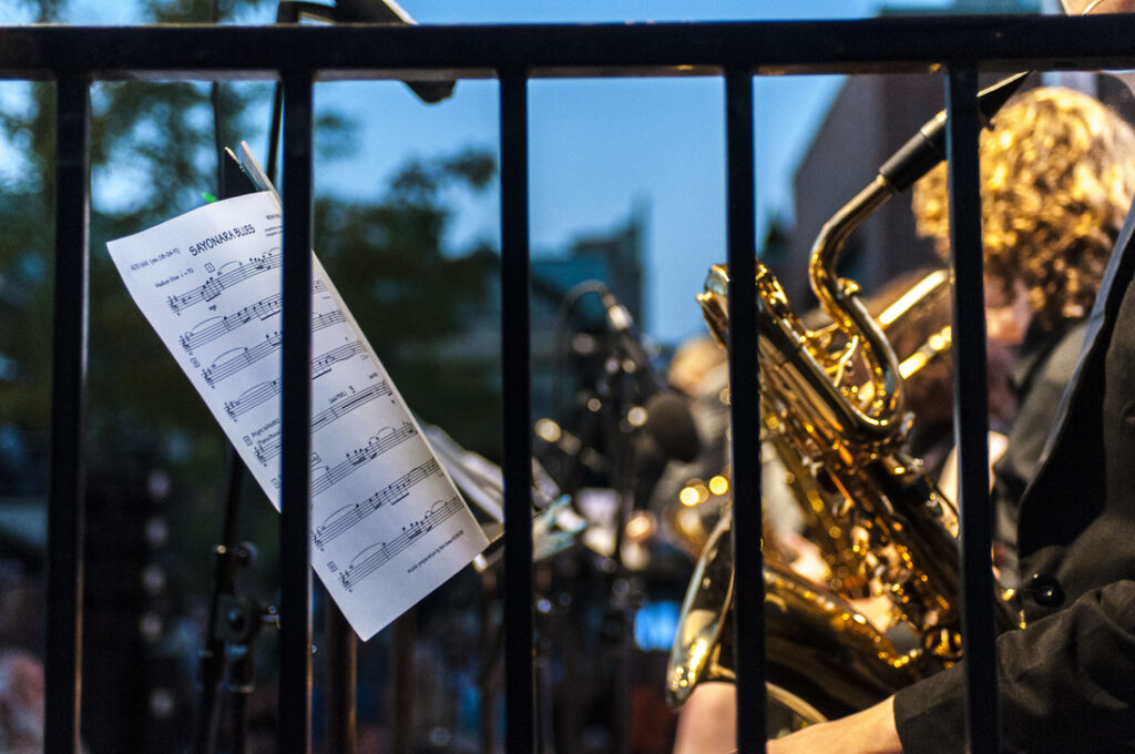 Sheet music for "Savannah Blues" and a saxophone player at a jazz festival Takeoff-Moving Toronto