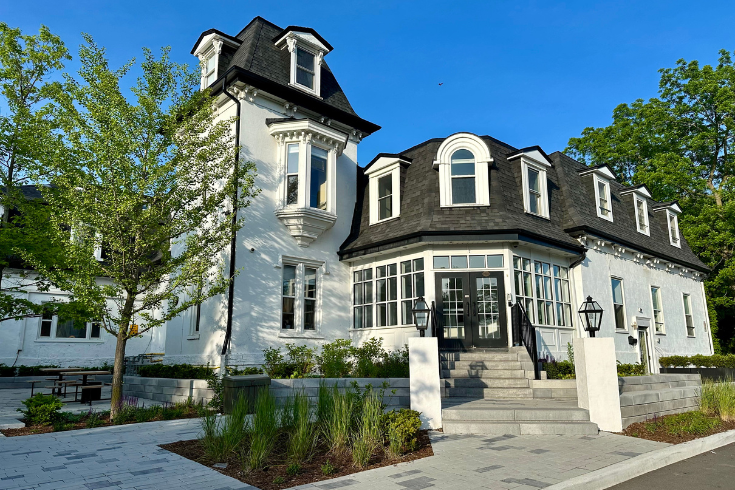 Charming white building with mansard roof in Oakville, ON Takeoff-Moving Toronto